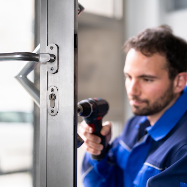 Technician installing a master key system for a Las Vegas business